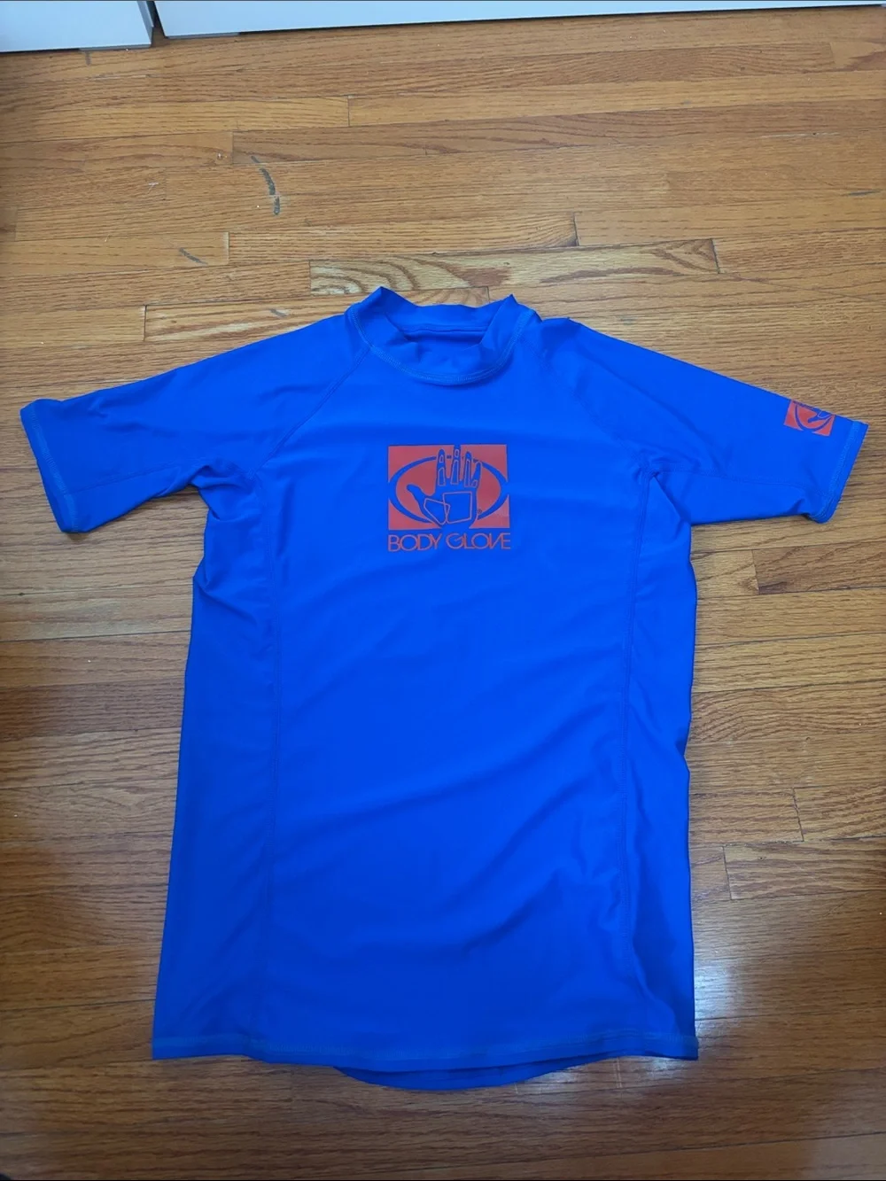 Body Glove blue and red rash guard tops